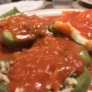 Stuffed peppers and mashed potatoes generously covered in tomato sauce. Yum!