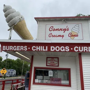an ice cream cone on top of a building