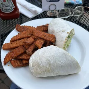 Spicy chicken wrap with sweet potato fries