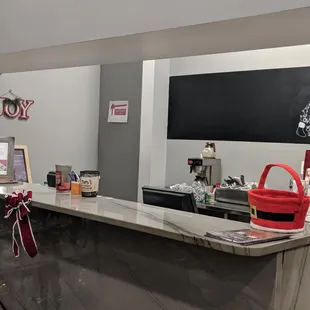a kitchen counter with a red bucket on it