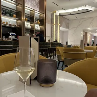 a glass of wine on a table