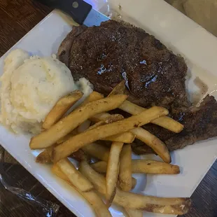 Ribeye, mashed potatoes and fries