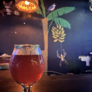 a glass of beer on a table