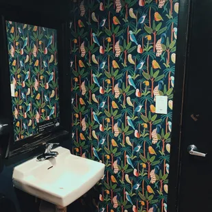 Love the bathroom wallpaper