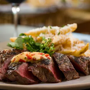 STEAK FRITES:
10oz New York strip, red pepper-garlic butter, parmesan french fries