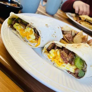 Bacon breakfast burrito with a side of country potatoes