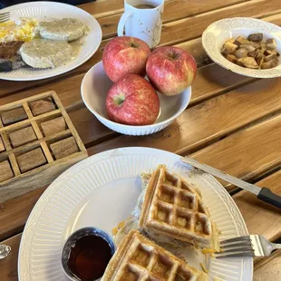 My amazing waffle sandwich, with real maple syrup, and the best fried potatoes. Also, the biscuit and gravy meal that rocked his world ;)