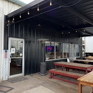 Outdoor seating area; inside has a cozy farmhouse feel
