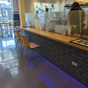 a restaurant counter with a blue light