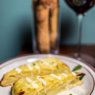 a plate of food and a glass of wine
