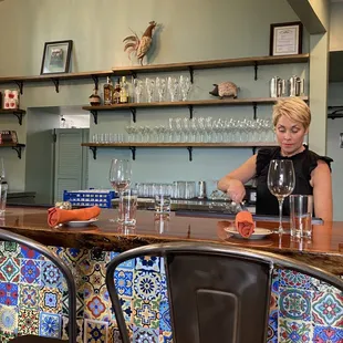 a woman sitting at a bar