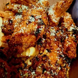 Garlic Parmesan wings with fries underneath