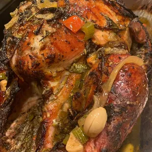 Golden brown Christmas turkey, covered in seasonings.