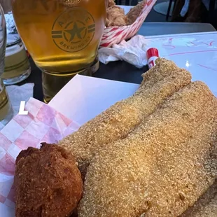 This is an amazing dish! Fish and Chips with Hushpuppies! Light and flavorful! Definitely will come back for more.