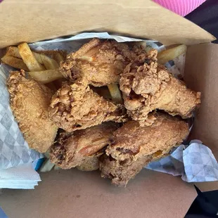 Fried chicken wings and fries
