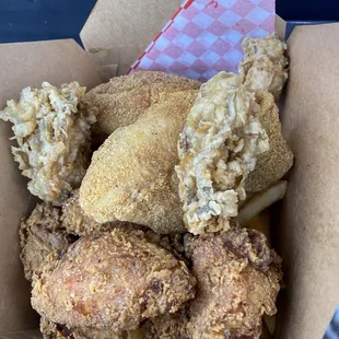 Basa fish , chicken , oysters , hush puppies and fries