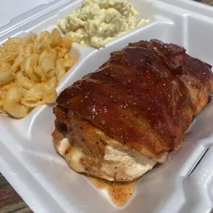 Chicken stuffed with pulled pork and cheese, then wrapped in three pieces of bacon