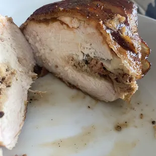 Chicken stuffed with pulled pork and cheese, then wrapped in three pieces of bacon