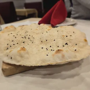 This bread is served first with olive oil and butter candles! So yummy! I'm not aware of its real name.