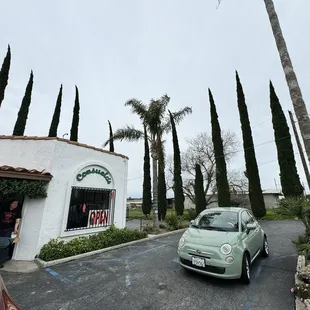 a car parked in front of a restaurant