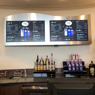 a bar with a menu on the wall