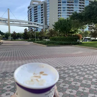 a person holding a cup of coffee