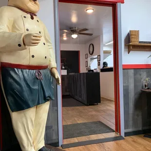 Looking at the order counter from the dining room, while Mr. Pepperoni looks on!