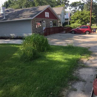 a red fire hydrant in front of a house
