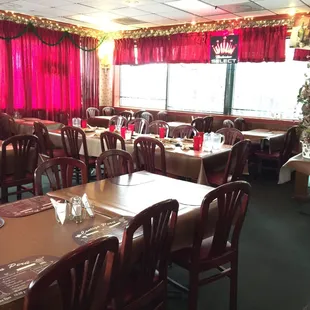 a dining room with a christmas tree