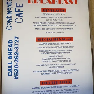 a breakfast menu displayed in a window