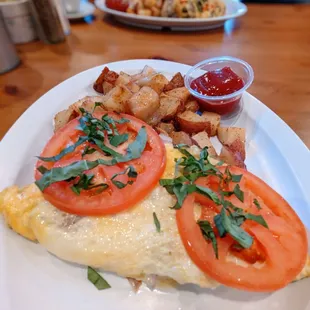 an omelet with tomatoes and potatoes