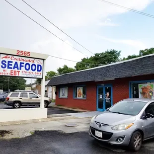 a car parked in front of a restaurant