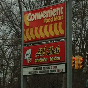 a car parked in front of the sign