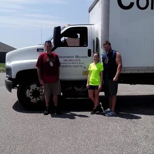 Convenient movers crew and the clients posing after a successful move.