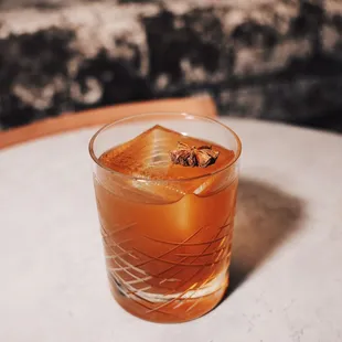 a drink in a glass on a table