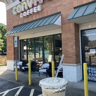 Iced strawberry latte and outside of store