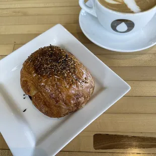 Oatmilk latte and ham and cheese croissant