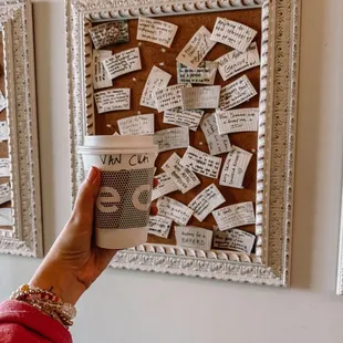 a person holding a cup of coffee