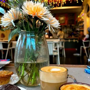 Triple chocolate and glazed apple spice muffins, oat milk latte and caramel latte