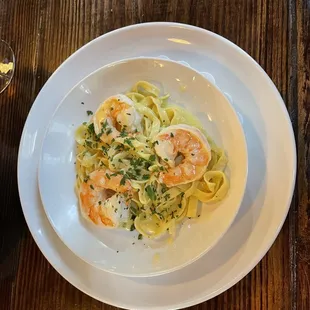 Tagliatelle with homemade egg noodles along with lemon zest, lemon juice, butter and delicious shrimp.