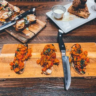 a cutting board with a variety of appetizers
