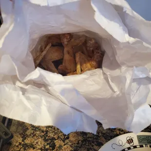 Wings,  served in paper bags so they don't get soggy