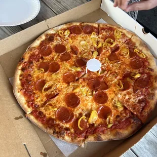a pepperoni pizza in a box