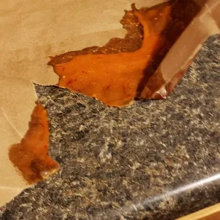 a person peeling a piece of paper