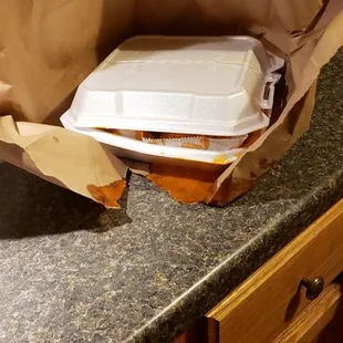 a brown paper bag on a kitchen counter