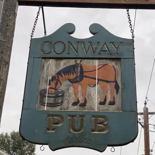 a horse drinking from a bowl