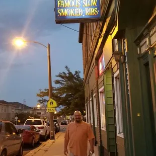  man walking down the sidewalk