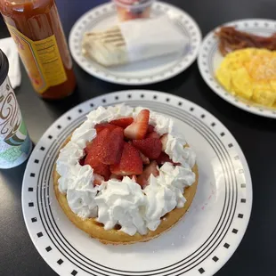 Belgian waffle with a TON of fresh strawberries and whipped cream