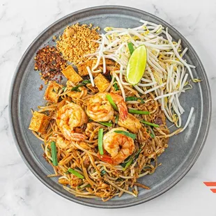 Pad Thai.
Pan Fried Rice noodle with chicken and shrimp, tofu, egg, ground peanuts, bean spout, and chive