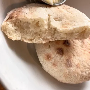 Like pillows. Baked to order. Not on the menu so ask for bread!